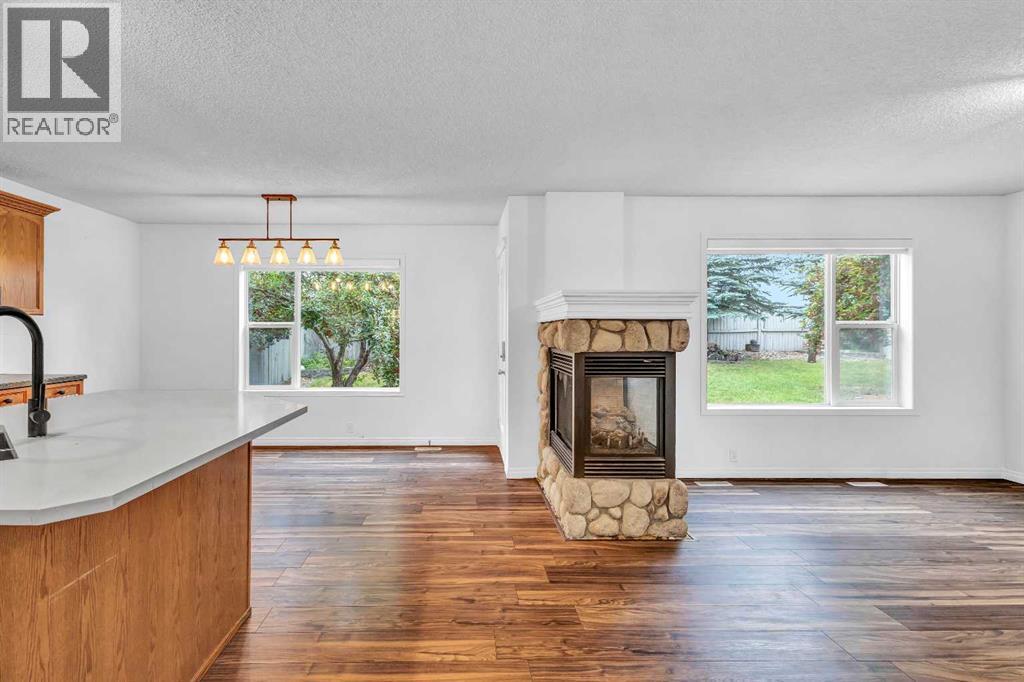 331 Springbank Place Sw, Calgary, AB - Indoor Photo Showing Living Room With Fireplace