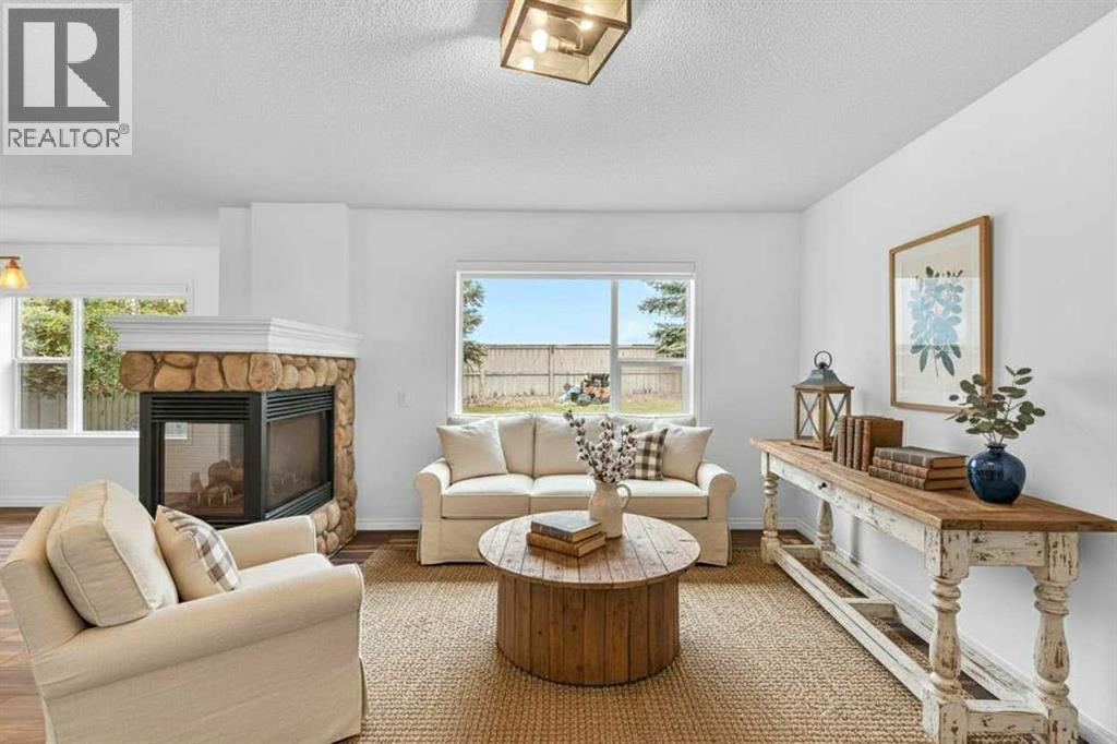 331 Springbank Place Sw, Calgary, AB - Indoor Photo Showing Living Room With Fireplace