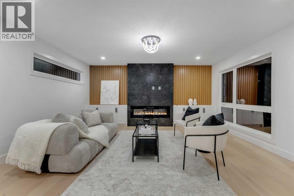9419 Academy Drive Se, Calgary, AB - Indoor Photo Showing Living Room With Fireplace