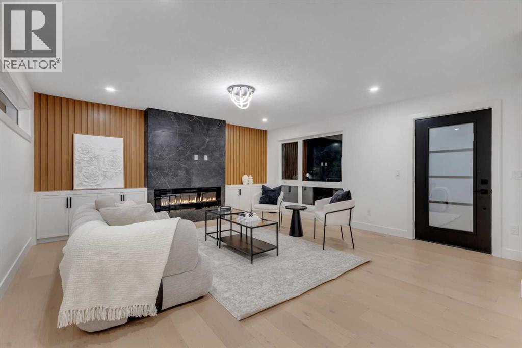 9419 Academy Drive Se, Calgary, AB - Indoor Photo Showing Other Room With Fireplace