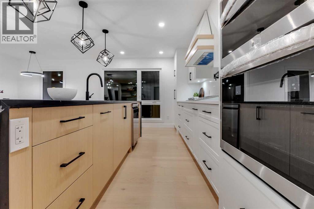 9419 Academy Drive Se, Calgary, AB - Indoor Photo Showing Kitchen With Upgraded Kitchen