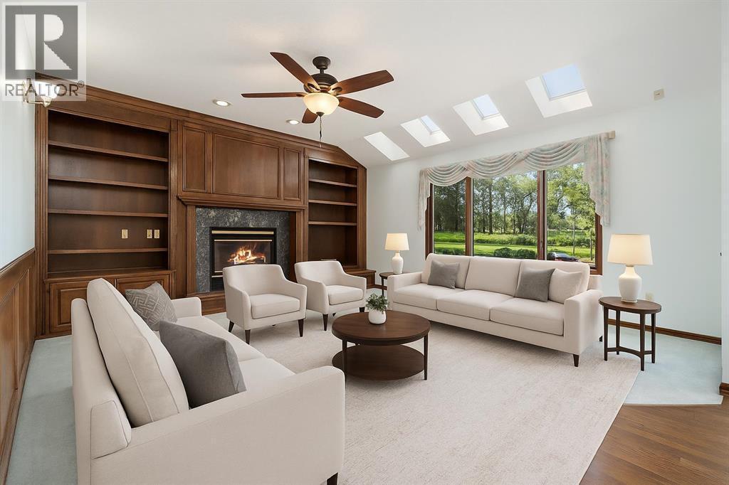 1600 Evergreen Hill Sw, Calgary, AB - Indoor Photo Showing Living Room With Fireplace