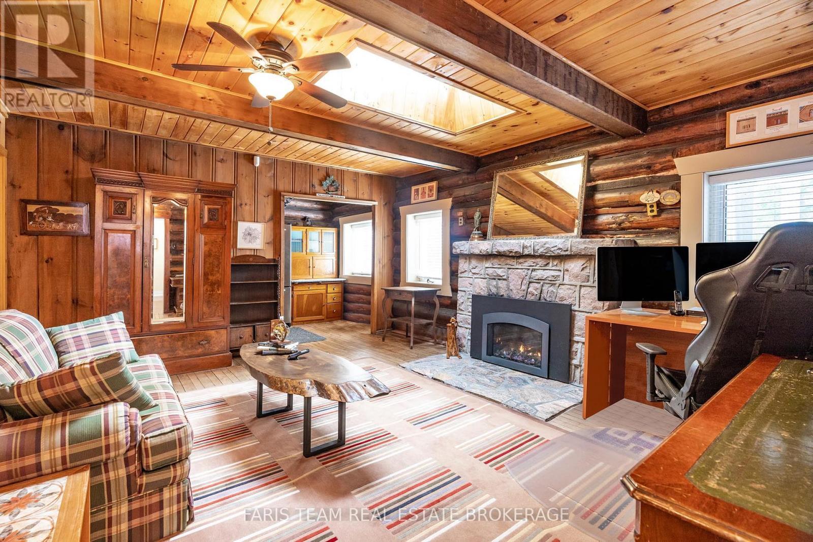 24 Finley Drive, Tiny, ON - Indoor Photo Showing Living Room With Fireplace