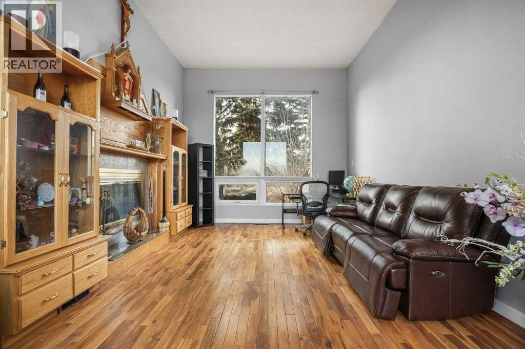 4704 Marbury Place Ne, Calgary, AB - Indoor Photo Showing Living Room With Fireplace