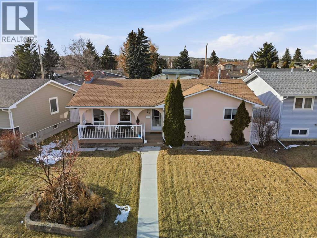 63 Huntmeadow Road Ne, Calgary, AB - Outdoor With Deck Patio Veranda