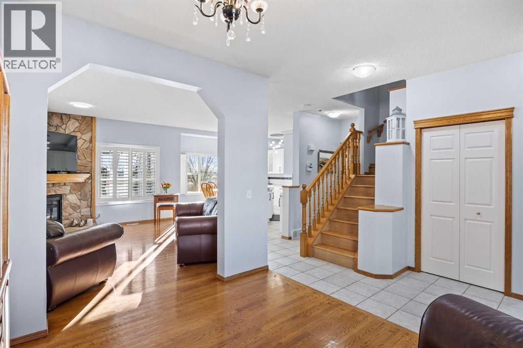 244 Oakmere Place, Chestermere, AB - Indoor Photo Showing Other Room With Fireplace