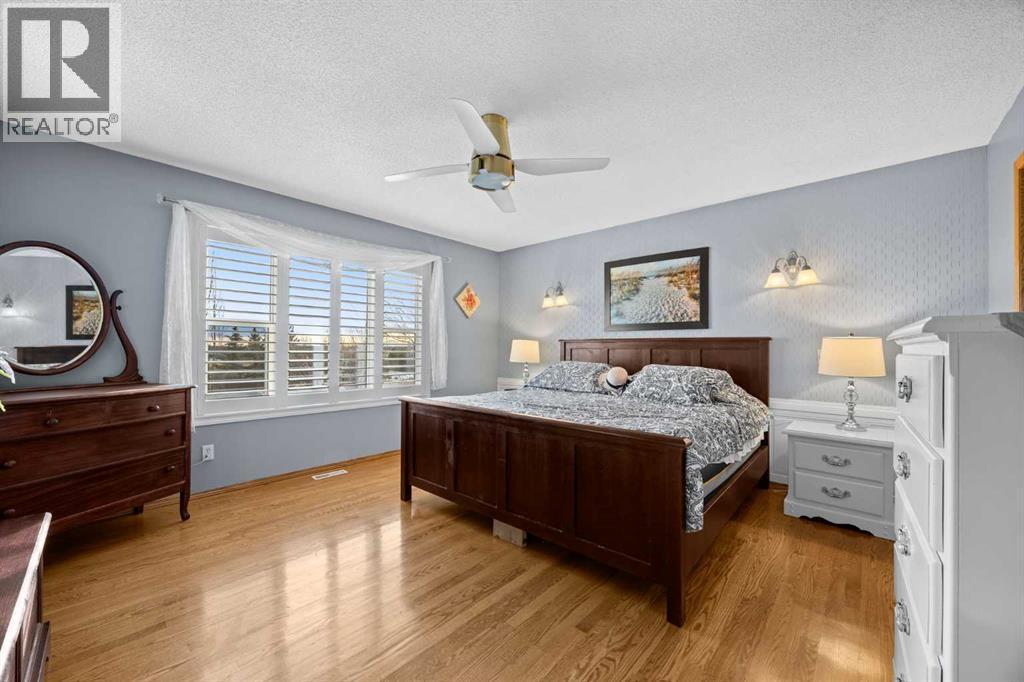 244 Oakmere Place, Chestermere, AB - Indoor Photo Showing Bedroom