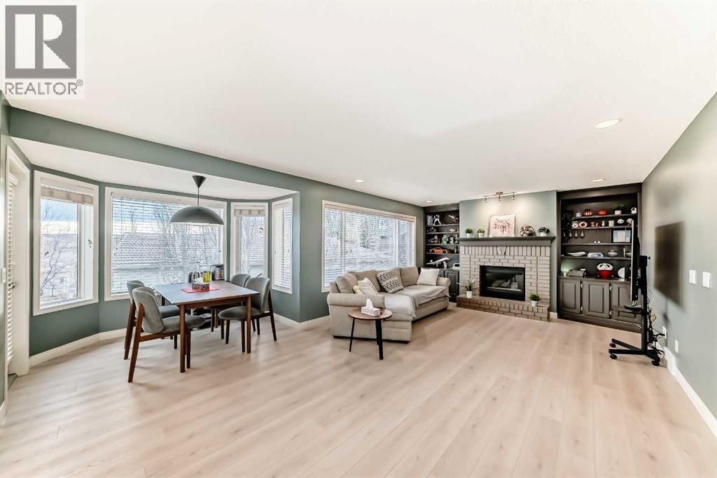 668 Scimitar Bay Nw, Calgary, AB - Indoor Photo Showing Living Room With Fireplace