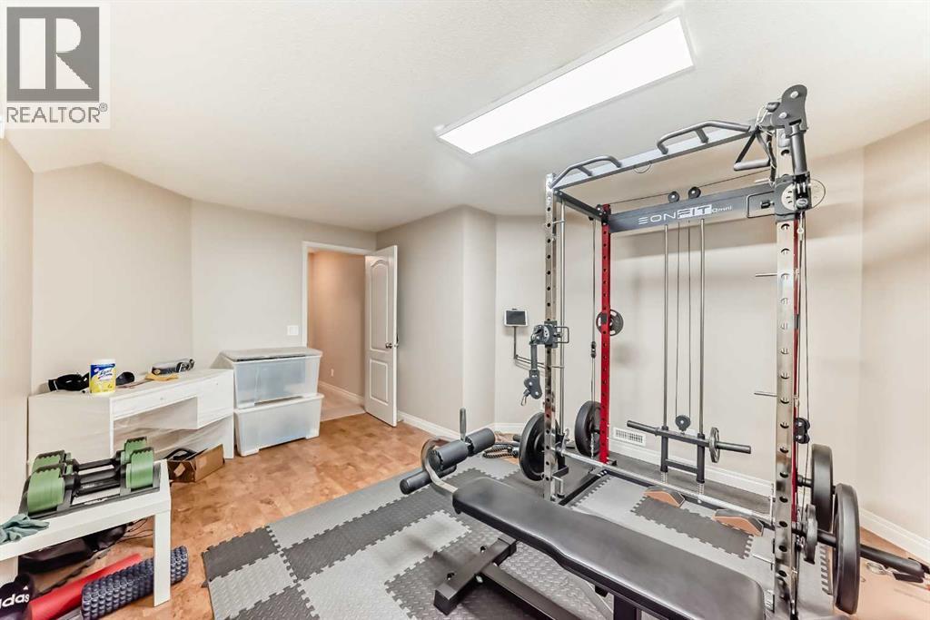 668 Scimitar Bay Nw, Calgary, AB - Indoor Photo Showing Gym Room