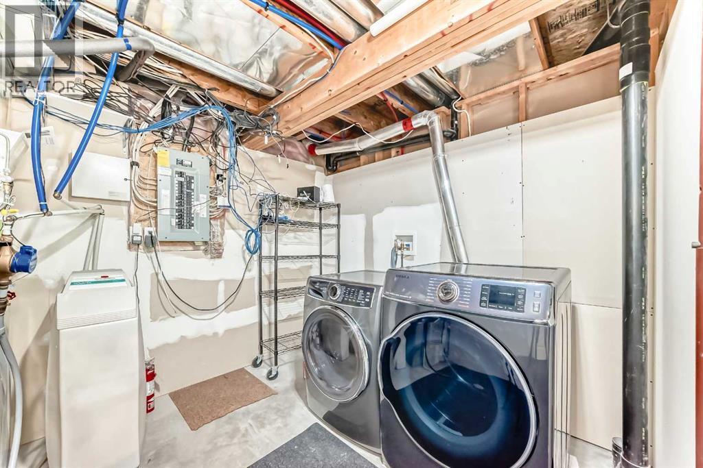 668 Scimitar Bay Nw, Calgary, AB - Indoor Photo Showing Laundry Room