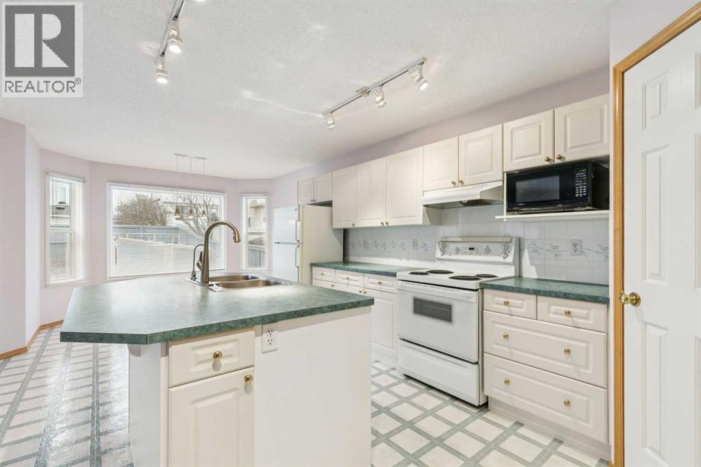 276 Hidden Valley Grove Nw, Calgary, AB - Indoor Photo Showing Kitchen With Double Sink