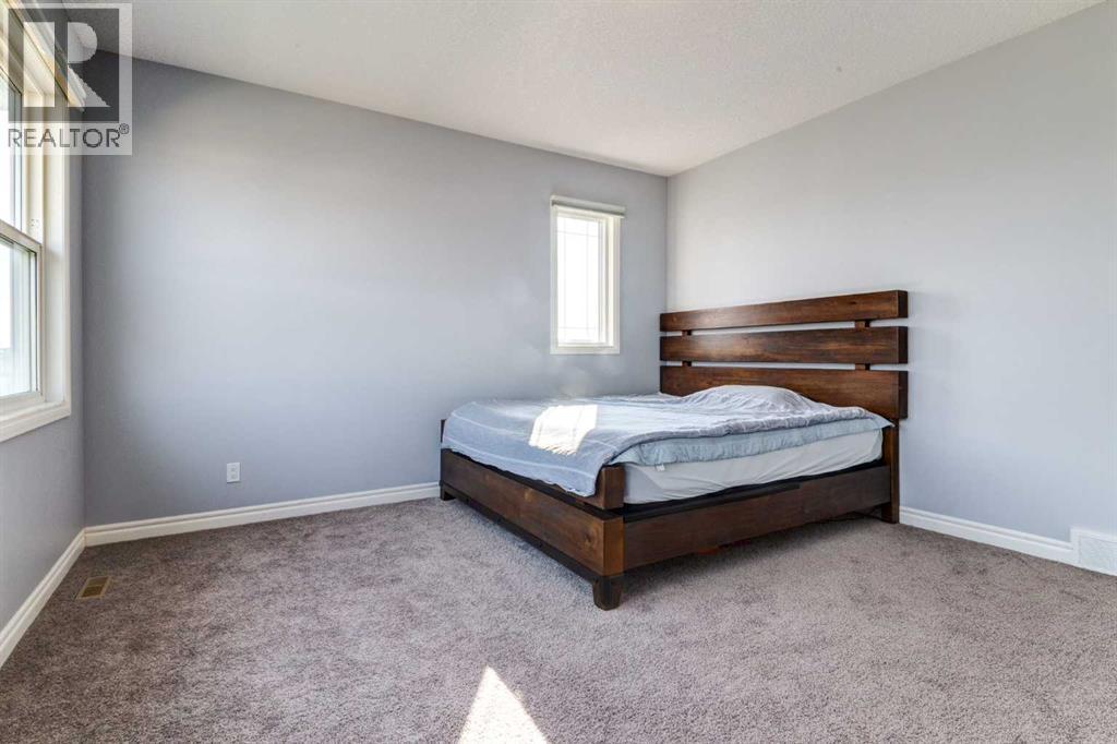 Master Bedroom - 14 Marquis Heights Se, Calgary, AB - Indoor Photo Showing Bedroom