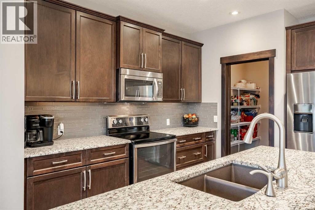 355 Evanston Way Nw, Calgary, AB - Indoor Photo Showing Kitchen With Double Sink With Upgraded Kitchen