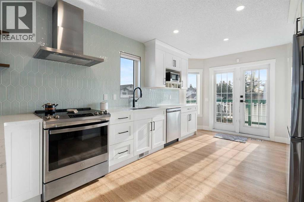 Kitchen - 111 Woodside Circle Nw, Airdrie, AB - Indoor Photo Showing Kitchen With Upgraded Kitchen