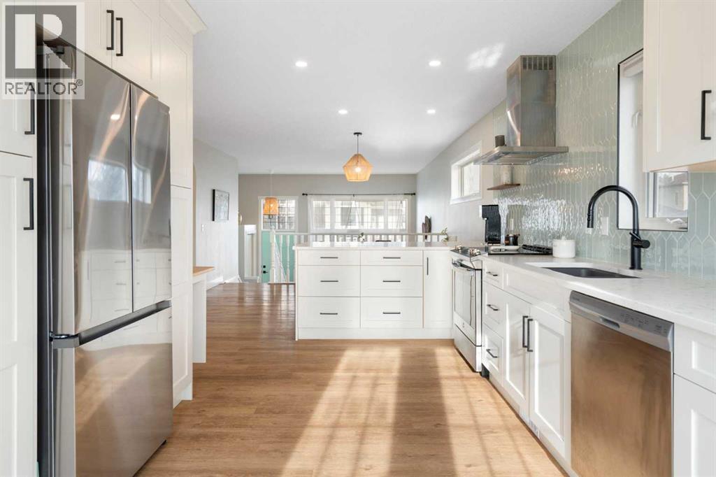 Kitchen - 111 Woodside Circle Nw, Airdrie, AB - Indoor Photo Showing Kitchen With Upgraded Kitchen