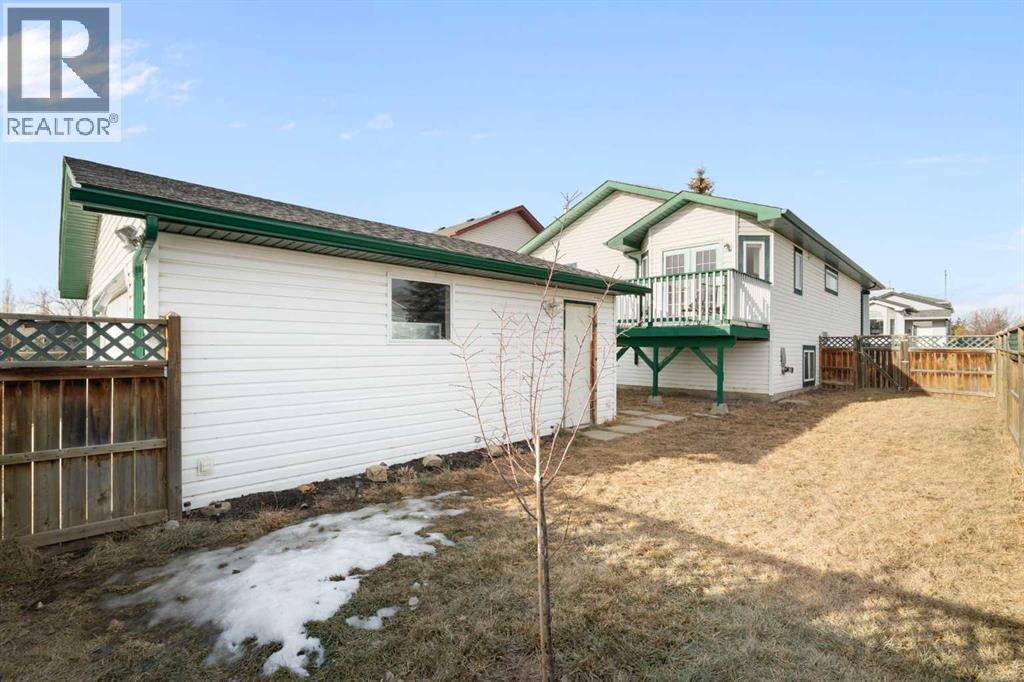Backyard - 111 Woodside Circle Nw, Airdrie, AB - Outdoor With Exterior