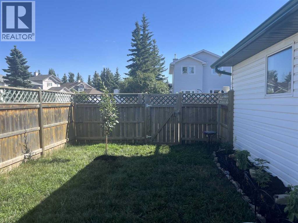 Backyard - 111 Woodside Circle Nw, Airdrie, AB - Outdoor