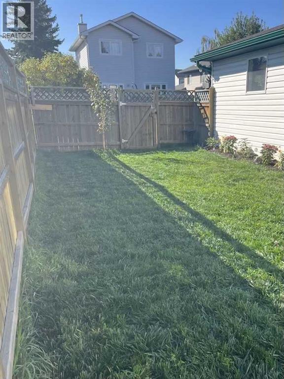 Backyard - 111 Woodside Circle Nw, Airdrie, AB - Outdoor