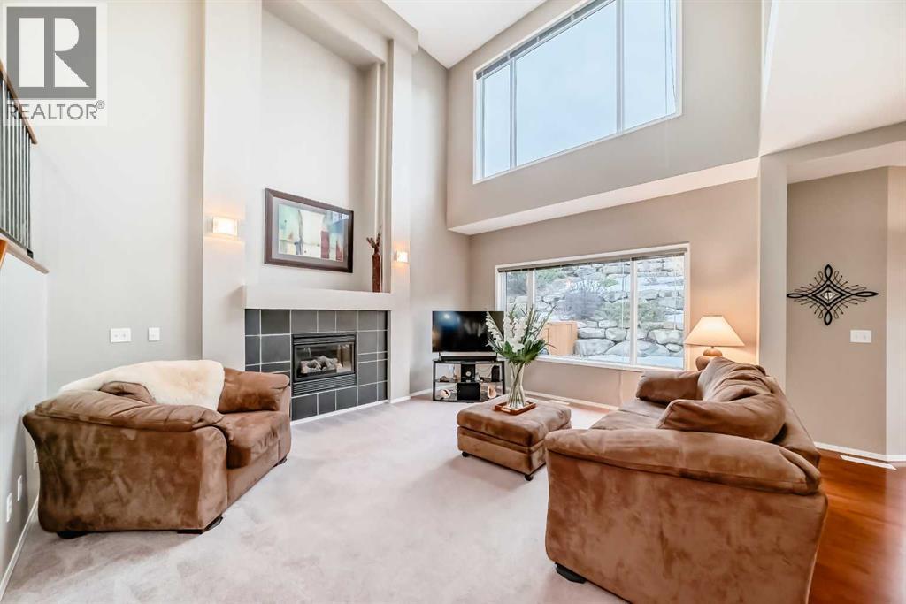 Grand family room - 11931 Valley Ridge Drive Nw, Calgary, AB - Indoor Photo Showing Living Room With Fireplace