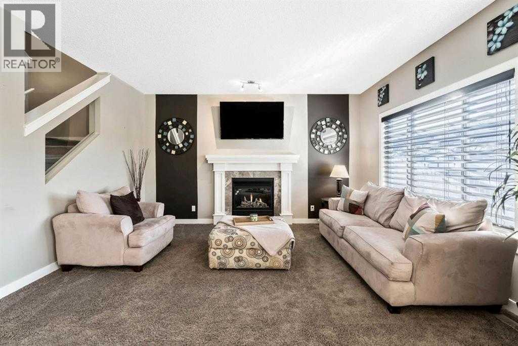 285 Evanspark Gardens Nw, Calgary, AB - Indoor Photo Showing Living Room With Fireplace