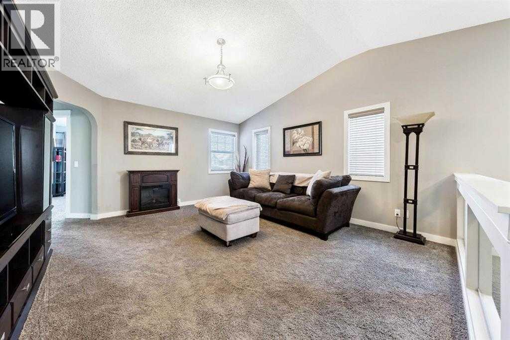 285 Evanspark Gardens Nw, Calgary, AB - Indoor Photo Showing Other Room With Fireplace