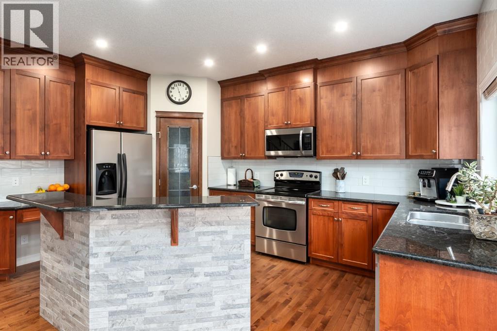 Tons of cabinet and pantry space - 128 Seagreen Manor, Chestermere, AB - Indoor Photo Showing Kitchen With Double Sink