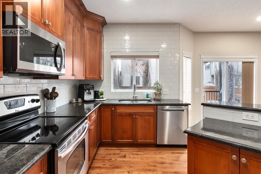 Stainless steel appliances - 128 Seagreen Manor, Chestermere, AB - Indoor Photo Showing Kitchen With Double Sink