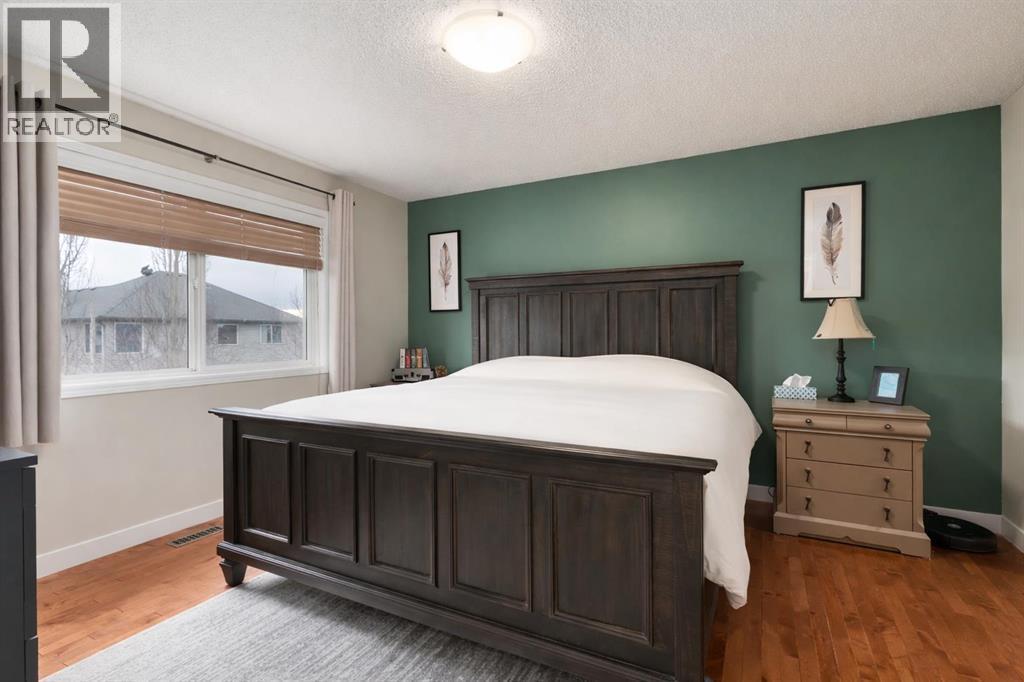 Primary bedroom - 128 Seagreen Manor, Chestermere, AB - Indoor Photo Showing Bedroom