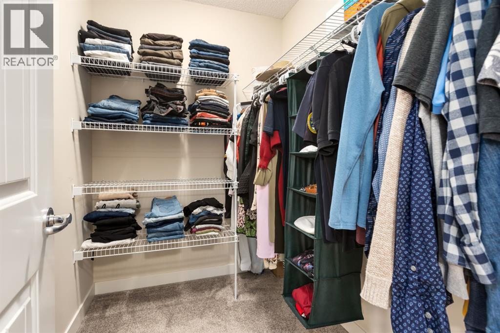 Walk-in closet - 128 Seagreen Manor, Chestermere, AB - Indoor With Storage