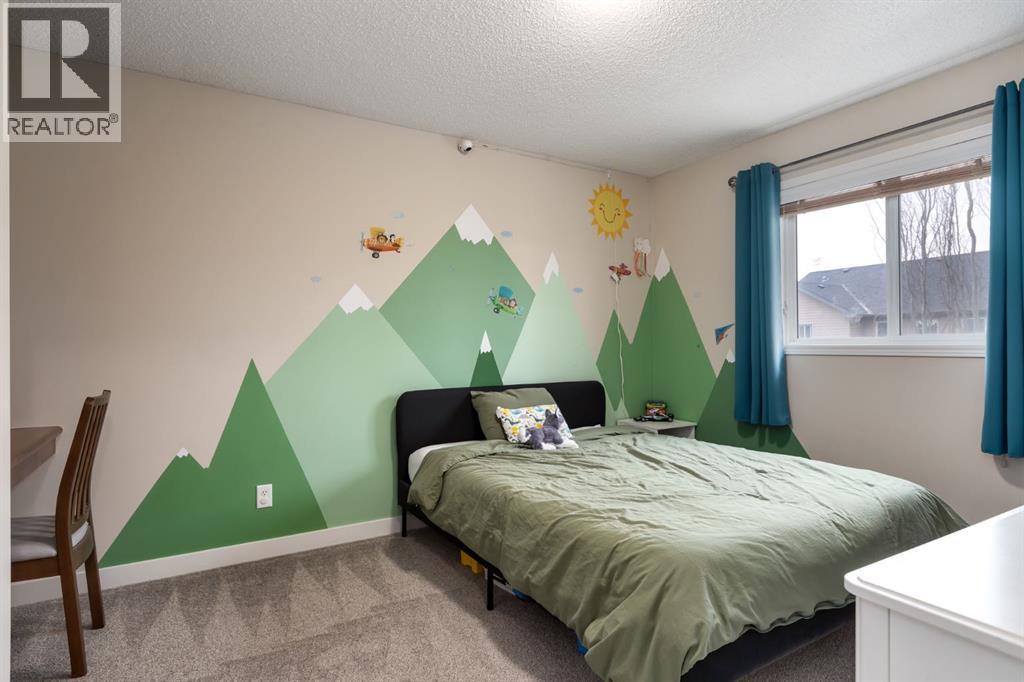 Bedroom #3 - 128 Seagreen Manor, Chestermere, AB - Indoor Photo Showing Bedroom