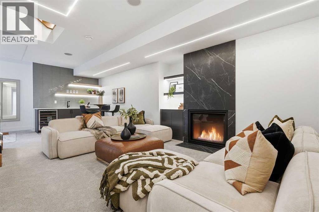 134 Lissington Drive Sw, Calgary, AB - Indoor Photo Showing Living Room With Fireplace
