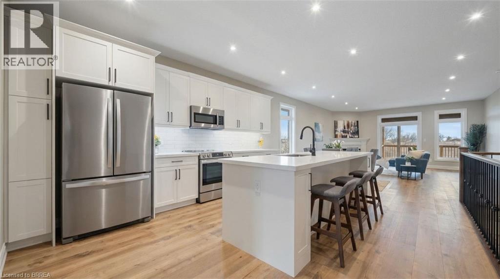 Virtually Staged - 187 Craddock Boulevard, Jarvis, ON - Indoor Photo Showing Kitchen With Upgraded Kitchen