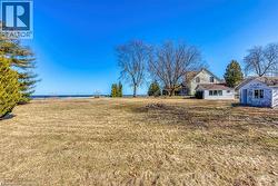 View of green lawn featuring a water view -