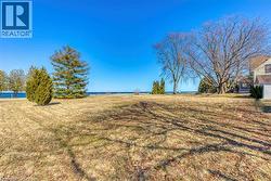 View of grassy yard featuring a water view -