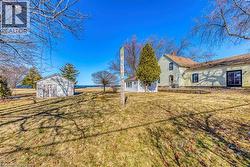 View of green lawn with an outdoor structure -