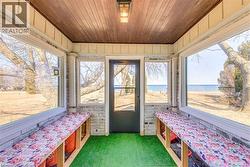 Sunroom / solarium with healthy amount of natural light and a water view -
