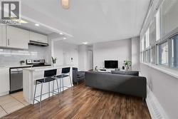 Living area featuring recessed lighting and wood finished floors -