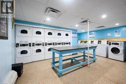 Common laundry area with visible vents, separate washer and dryer, and stacked washer / drying machine -