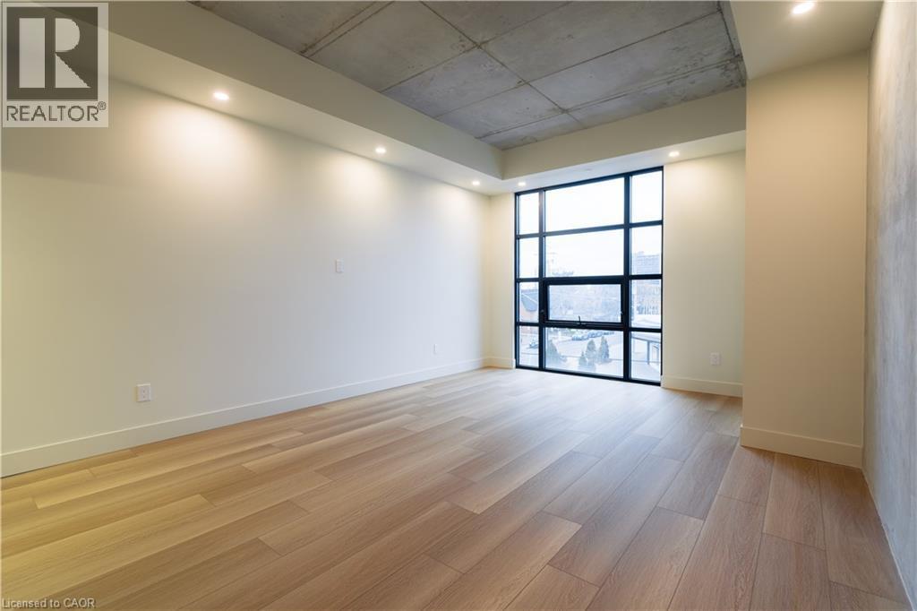 Spare room with light wood finished floors and recessed lighting - 24 Augusta Street Unit# 305, Hamilton, ON - Indoor Photo Showing Other Room