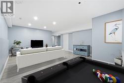 Living room featuring recessed lighting and light wood-type flooring -