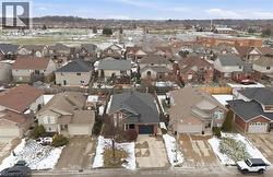 Aerial overview of property's location with nearby suburban area -