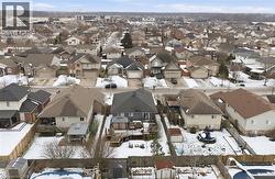Snowy aerial view with a residential view -