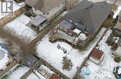 Snowy aerial view with a residential view -