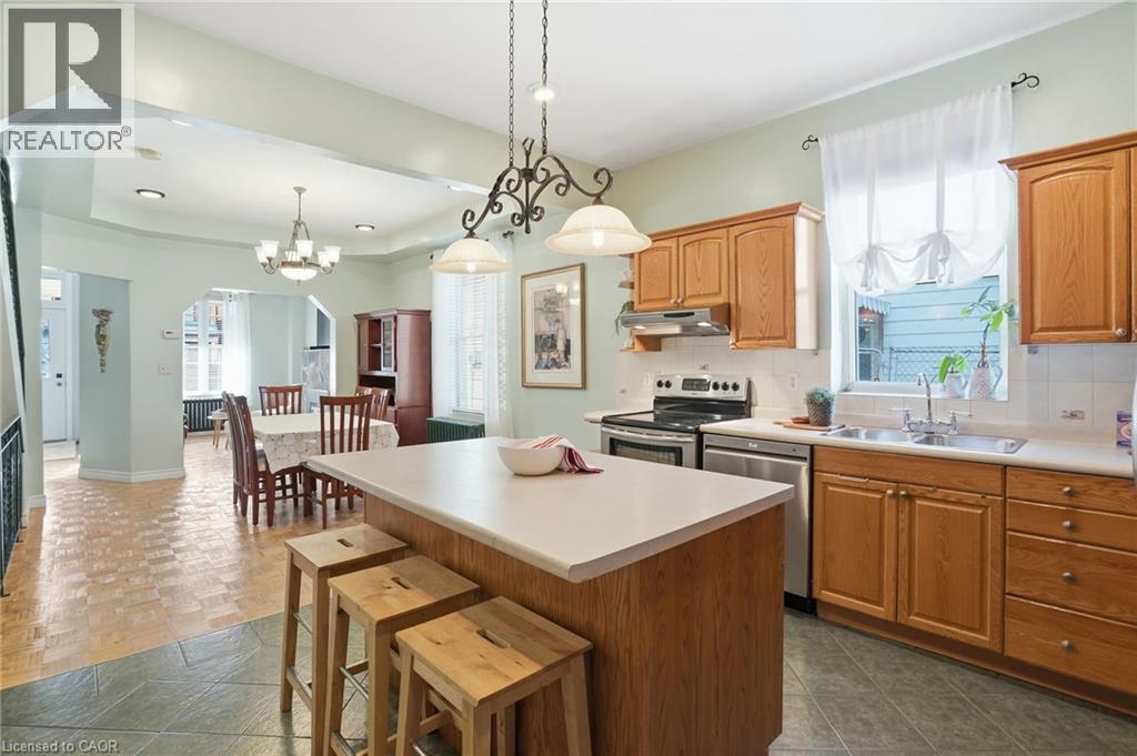 Large island for baking or eating breakfast! - 81 Simcoe Street E, Hamilton, ON - Indoor Photo Showing Kitchen With Double Sink