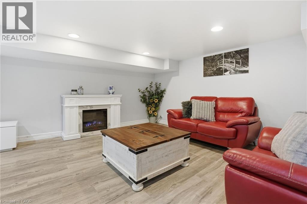 81 Simcoe Street E, Hamilton, ON - Indoor Photo Showing Living Room With Fireplace
