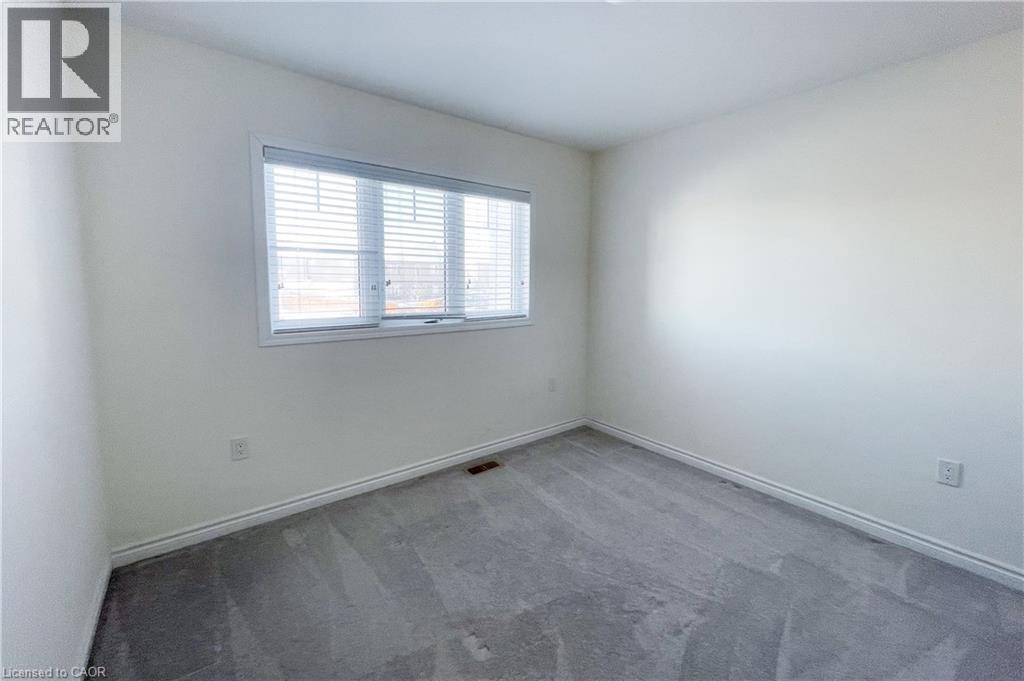Carpeted empty room featuring baseboards - 116 Watermill Street, Kitchener, ON - Indoor Photo Showing Other Room