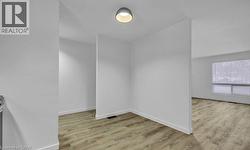 Unfurnished room featuring light wood-style floors -