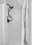 Full bath featuring a stall shower -