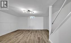 Bonus room featuring light wood-style flooring -