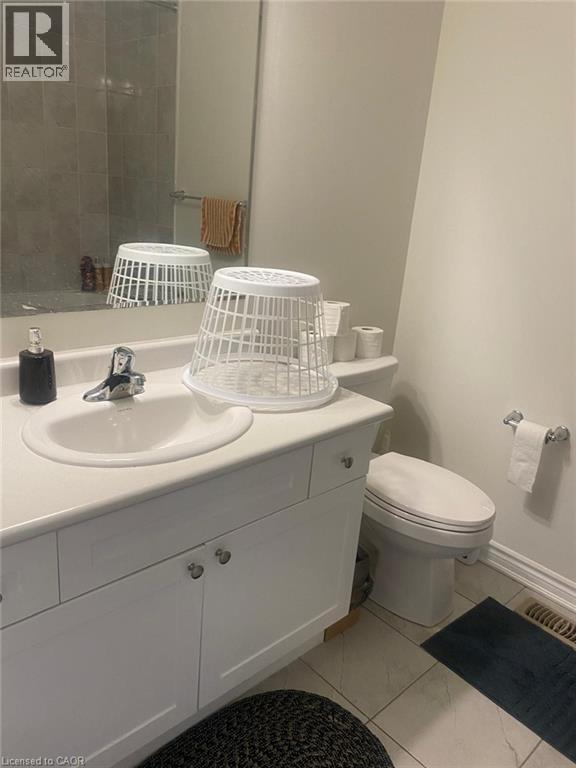 Bathroom with vanity and toilet - 128 Watermill Street, Kitchener, ON - Indoor Photo Showing Bathroom